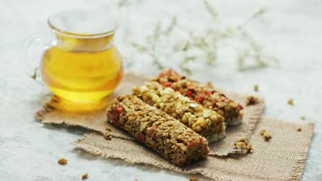 delicious cereal bars and honey in jar