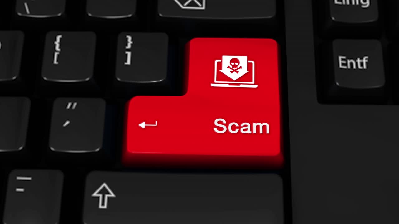 Red Scam Button on a Keyboard with a Skull and Laptop Icon