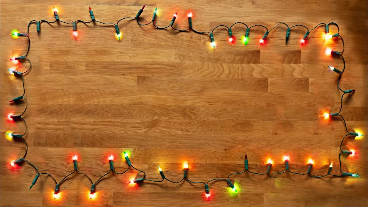 Loopable light effect made with colorful string lights turning on and off partially. There is an emtpy space at the center to be able to be filled