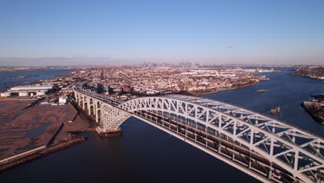 pristine aerial of bayonne bridge, staten island, route 440, new york city skyline on horizon