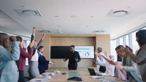 crazy business people celebrating in boardroom successful sales team corporate victory colleagues applause in office meeting enjoying winning success 4k