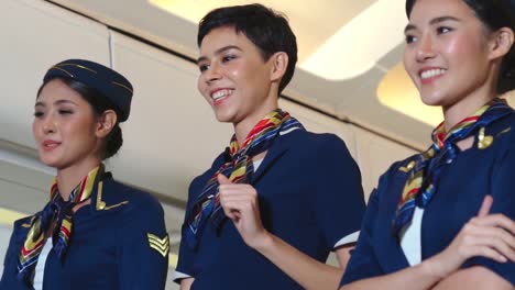 cabin crew dancing with joy in airplane