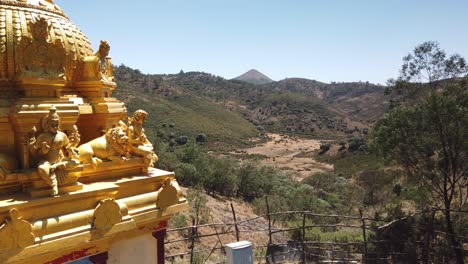 golden hindu temple in nilgiri biosphere reserve outside ooty, tamil nadu, india