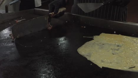 Chef-Making-Omelet-in-a-Hotel-Kitchen