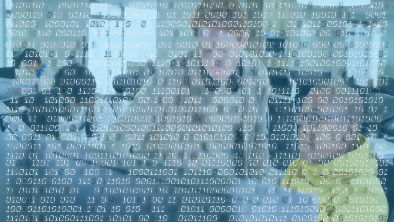 Lead dev pointing and tapping, guiding seated dev doing tech review, binary overlay over monitors