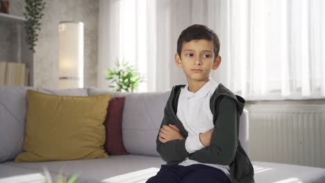 Thoughtful-boy-at-home.