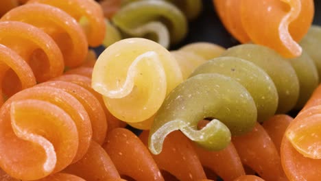 colored macaroni fusilli, macro shot