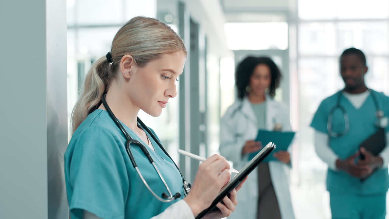 Doctors and Nurses Using Technology in a Hospital