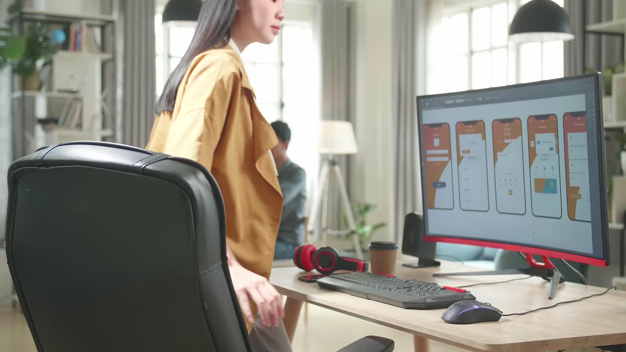 Asian Female Mobile Application Developer Start Works With Graphics On Her Personal Computer In Office