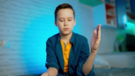 boy applying alcohol spray or anti bacteria spray to prevent spread of germs, bacteria and virus. personal hygiene concept.