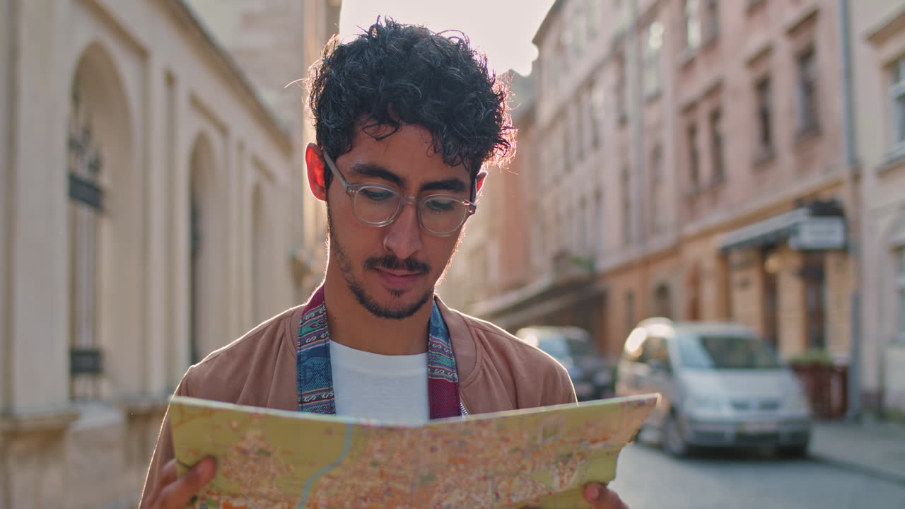 Tourist with a Map in a City