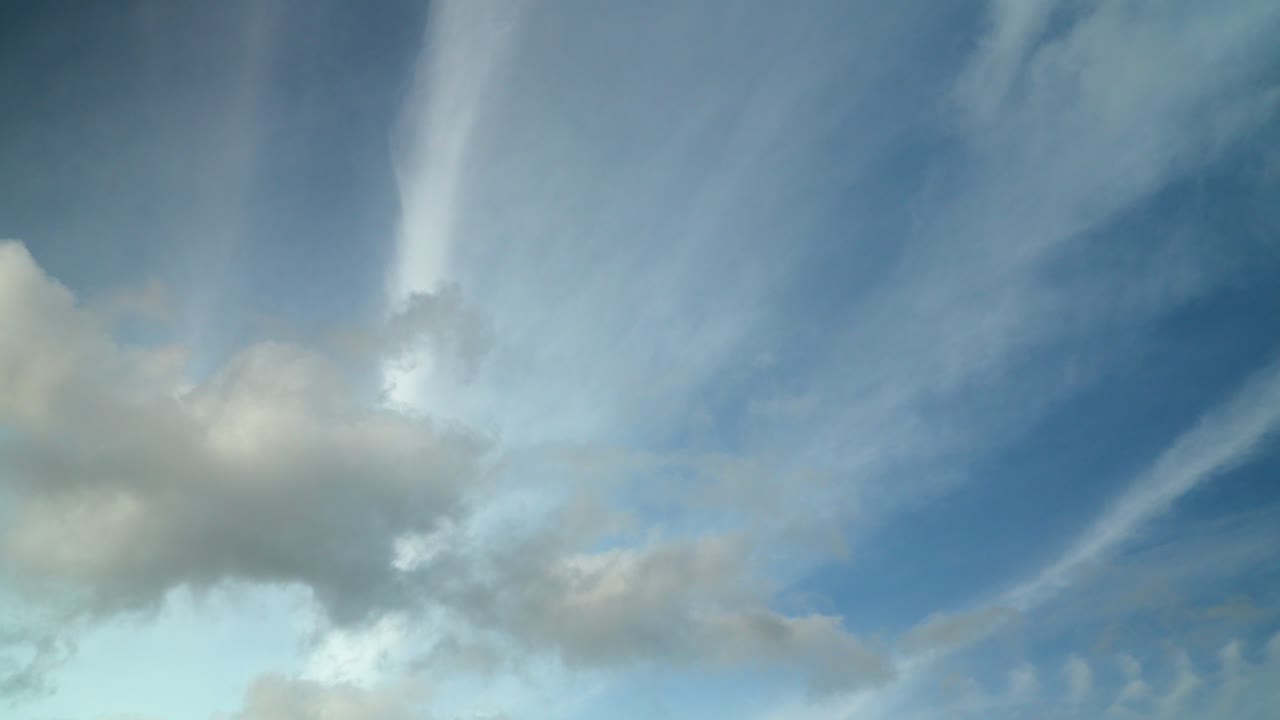 Cumulus Clouds Rolling Under Higher Cloud Deck Of Contrails Which Move In A Different Direction. Summer, England. Time Lapse 30X