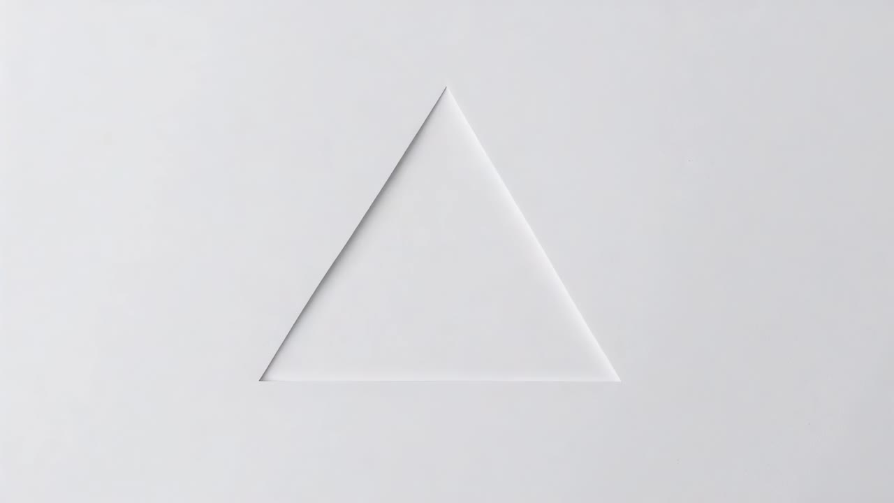 Rotating triangular plane starting tilt in studio, revealing tonal faces with rim and soft shadow