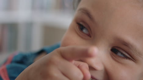 portrait-happy-little-girl-smiling-with-natural-childhood-curiosity-looking-joyful-child-with-innocent-playful-expression-4k-footage