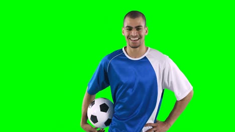 smiling football player performing a skill