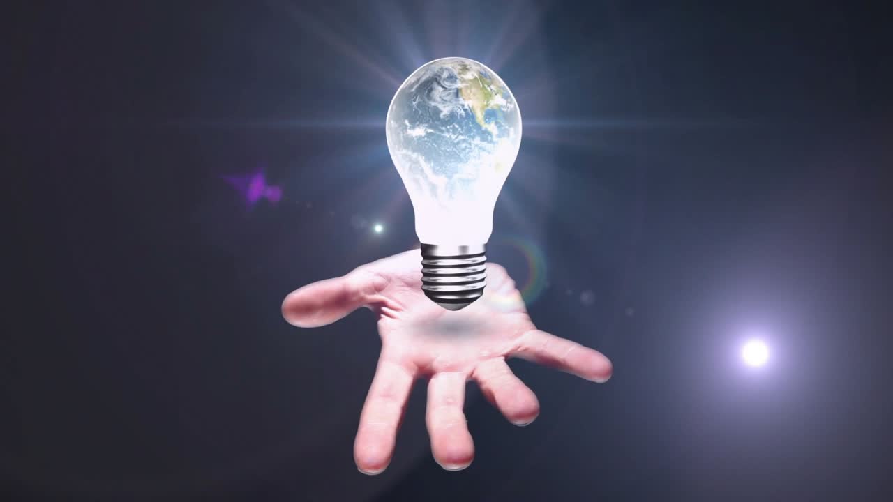 Dopo una pausa, la mano destra emerge tenendo una lampadina con la Terra che ruota, emettendo bagliori e dissolvendosi