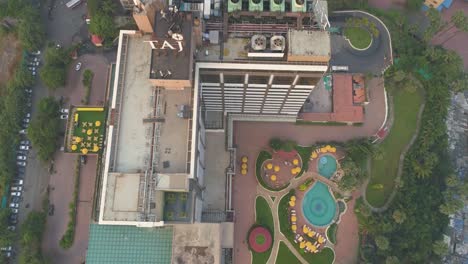 a cinematic drone shot of taj lands end hotel in mumbai seen from an aerial view in slow motion