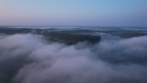 aerial view high above lake monroe in bloomington, indiana with clouds in the early morning light