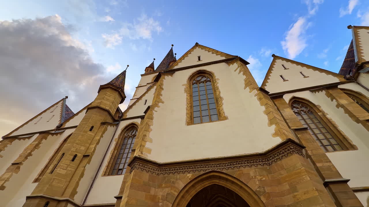 Gothic Architecture of Sibiu Cathedral. Close-up view of the Gothic architecture of the Lutheran Cathedral in Sibiu, Romania, highlighting its historic design