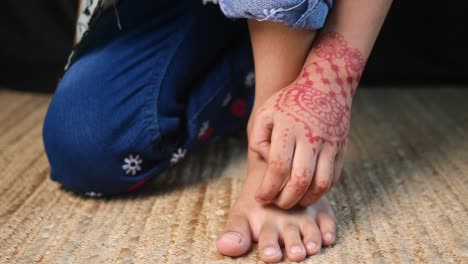 a woman's hand with beautiful henna art