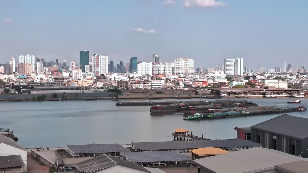 View of Bangkok from above showing city life and the river