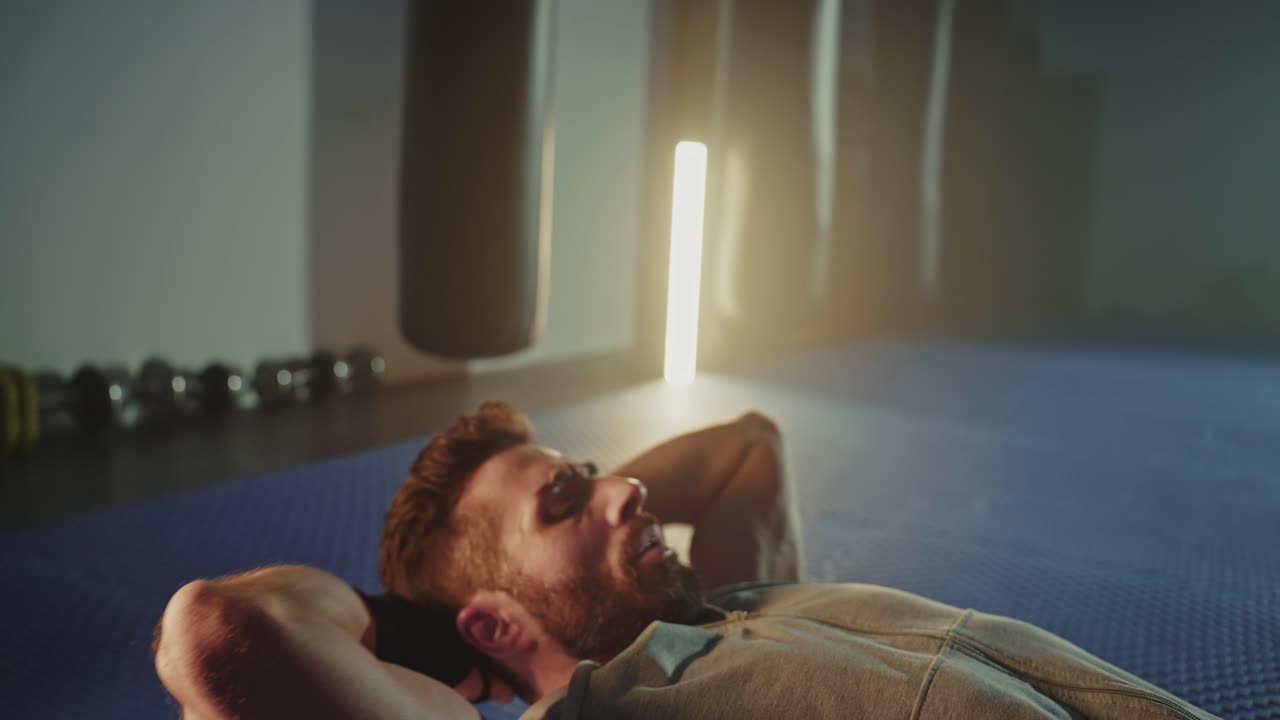 Man Doing Abdominal Exercises in a Gym