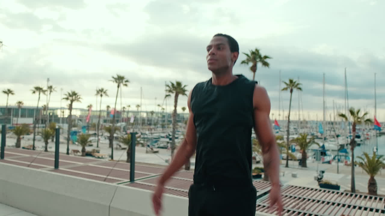 Man Doing Jumping Jacks at a Marina