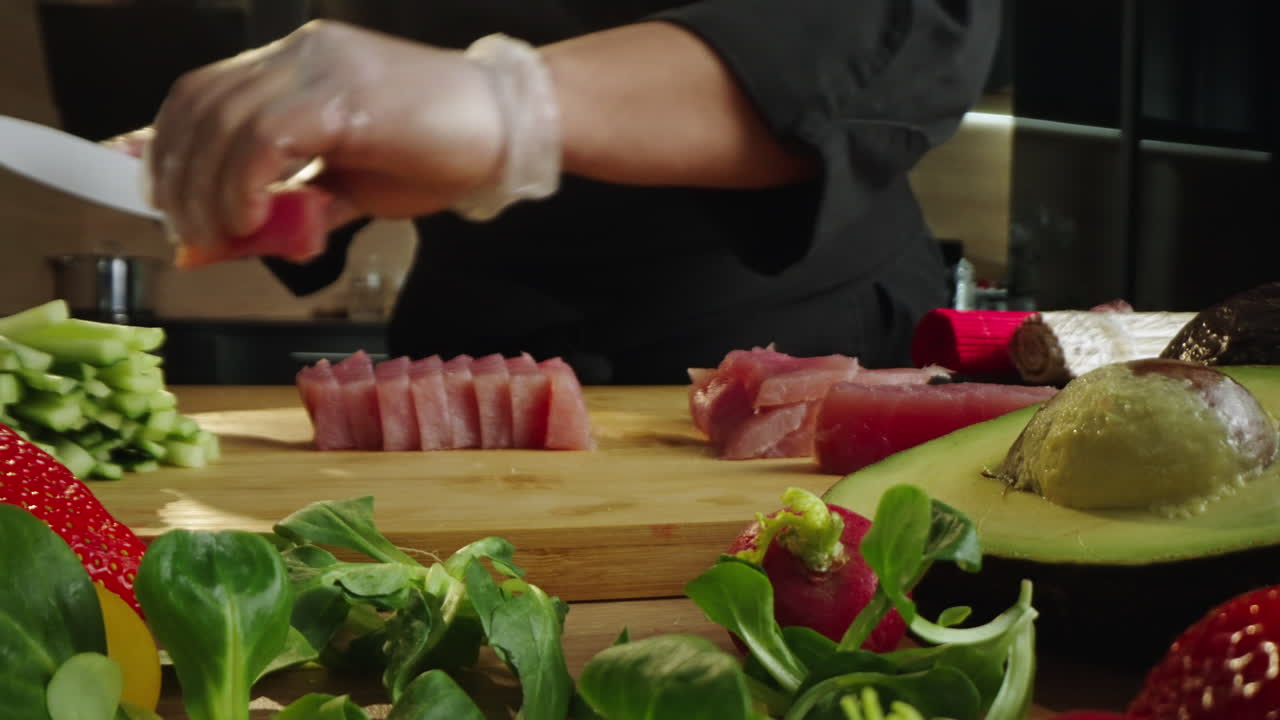 Chef Cutting Fresh Tuna for Sushi or Sashimi