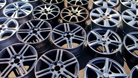 car wheel - collection of car rims on the ground. - high angle shot