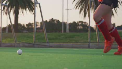 Female-hockey-players-playing-on-the-field