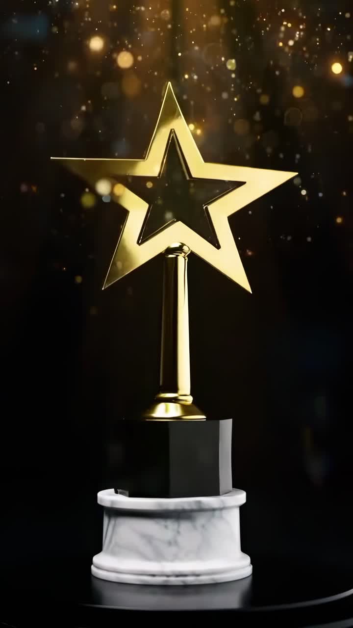 Close-up video of a star-shaped trophy on a marble base, with a bokeh effect background