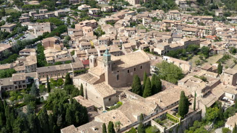 royal charterhouse towering above valldemossa historical town, spain