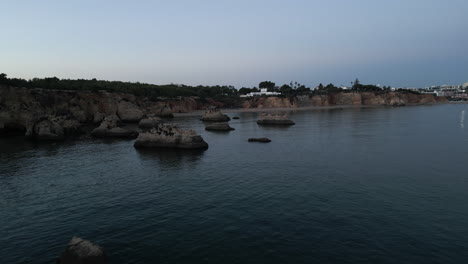 wide drone angle of a sunset in algarve, portugal