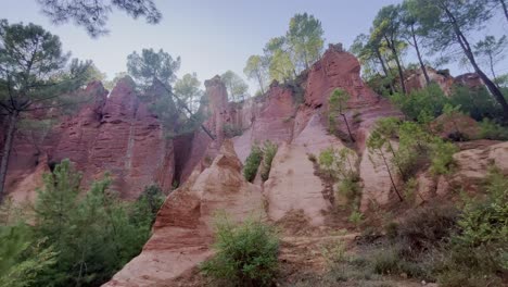 Exciting-rock-structure-in-France-with-some-trees-and-bushes-and-blue-sky