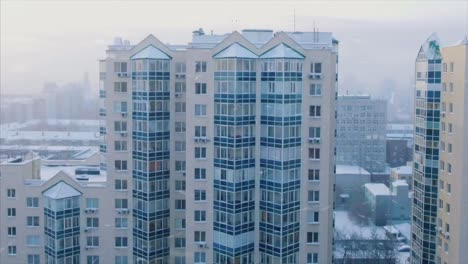 snowy cityscape with high-rise buildings