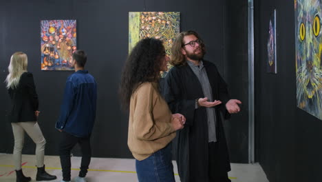 people viewing art at an exhibition