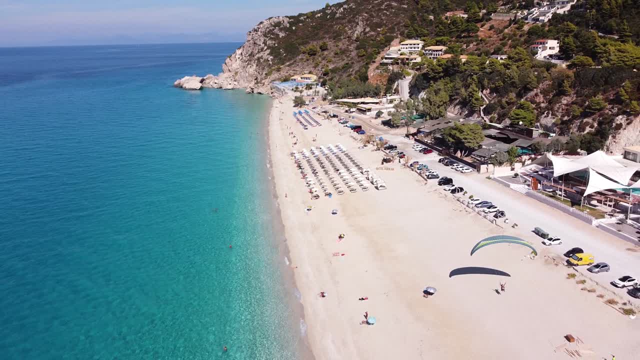 Tourist Parasailing at Kathisma Beach, Lefkada Island, Greece - Reversing Aerial