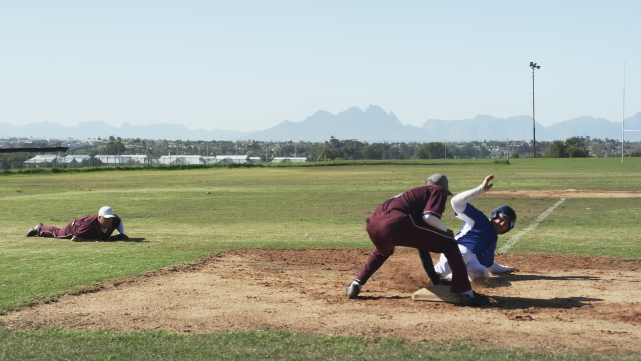 Multiracial male baseball players, throwing and catching ball, running on a pitch, slow motion