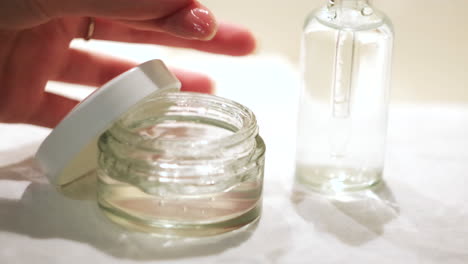 applying facial serum and cream