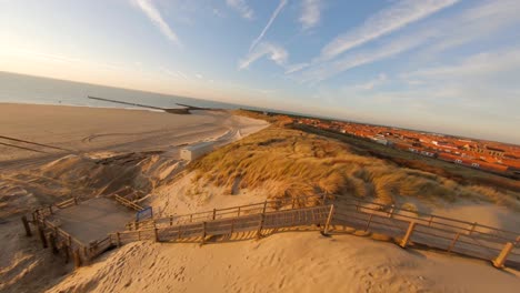 Fast-aerial-shot-from-a-beach-and-dunes-being-prepared-for-the-winter-in-The-Netherlands