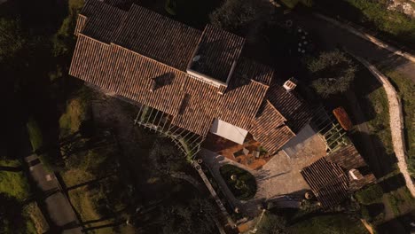 a secluded house on the french riviera, capturing the essence of luxury and privacy, surrounded by lush gardens, aerial view