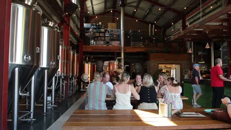 group of people socializing during a brewery tour