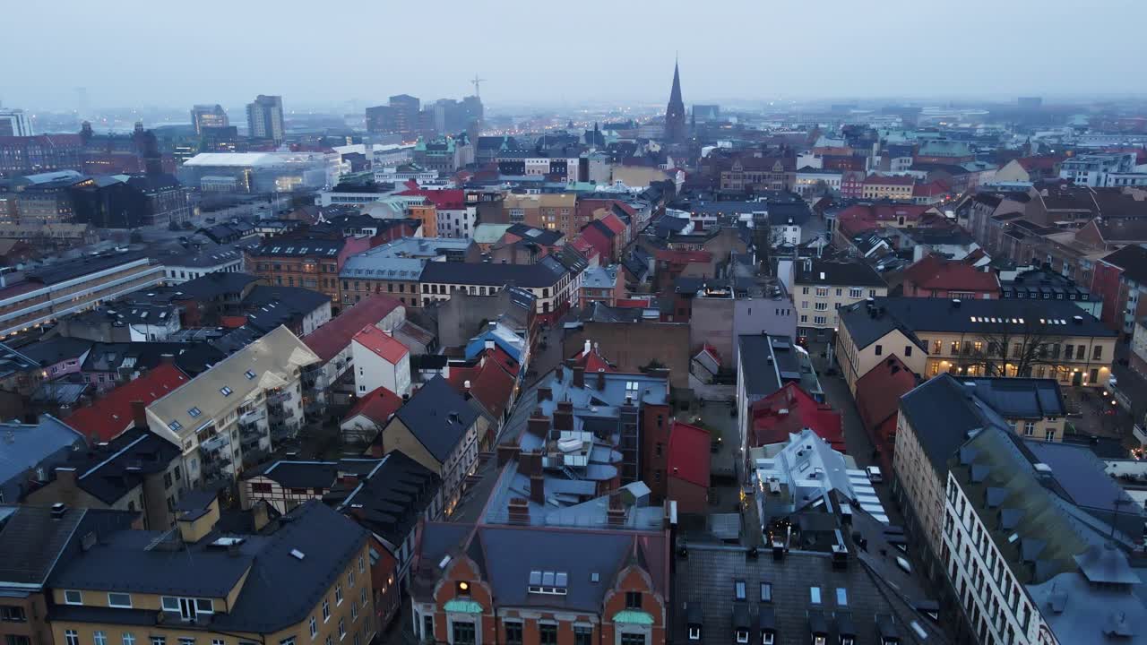 Beautiful jib up of the Malmö city skyline on a foggy morning in Sweden