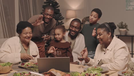 family celebrates christmas together with a video call