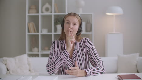 portrait of young woman talking by internet using headphones with microphone active sales manager working remotely