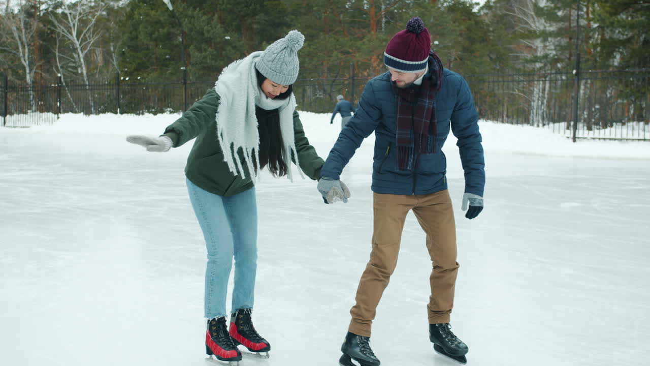 Couple Ice Skating in Winter