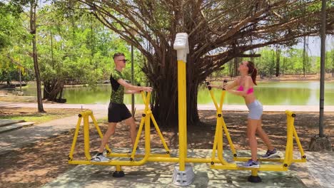 couple exercising at a park