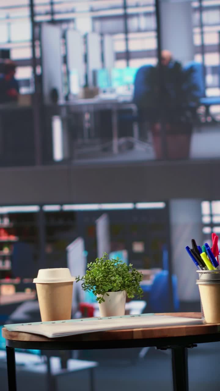 Workplace Desk with Coffee Cup and Plant in Modern Office