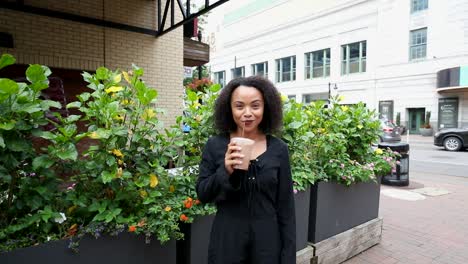 Young-woman-bumps-coffee-into-the-camera