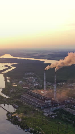 scenic rural landscape. aerial view of rural landscape against sunset vertical video